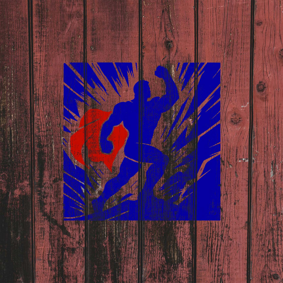 Blue Heroic Superhero Silhouette Stencil with red cape stands out on rustic red wood planks