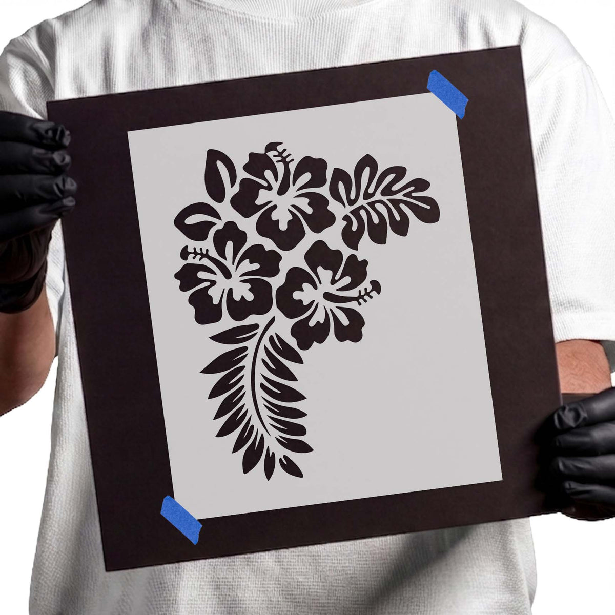 Hibiscus stencil with three tropical flowers and leafy accents