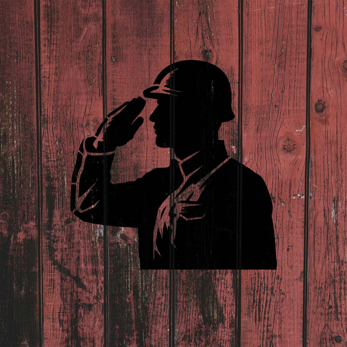 A bold soldier silhouette from the Honor Guard Salute Stencil stands out on rustic red wood