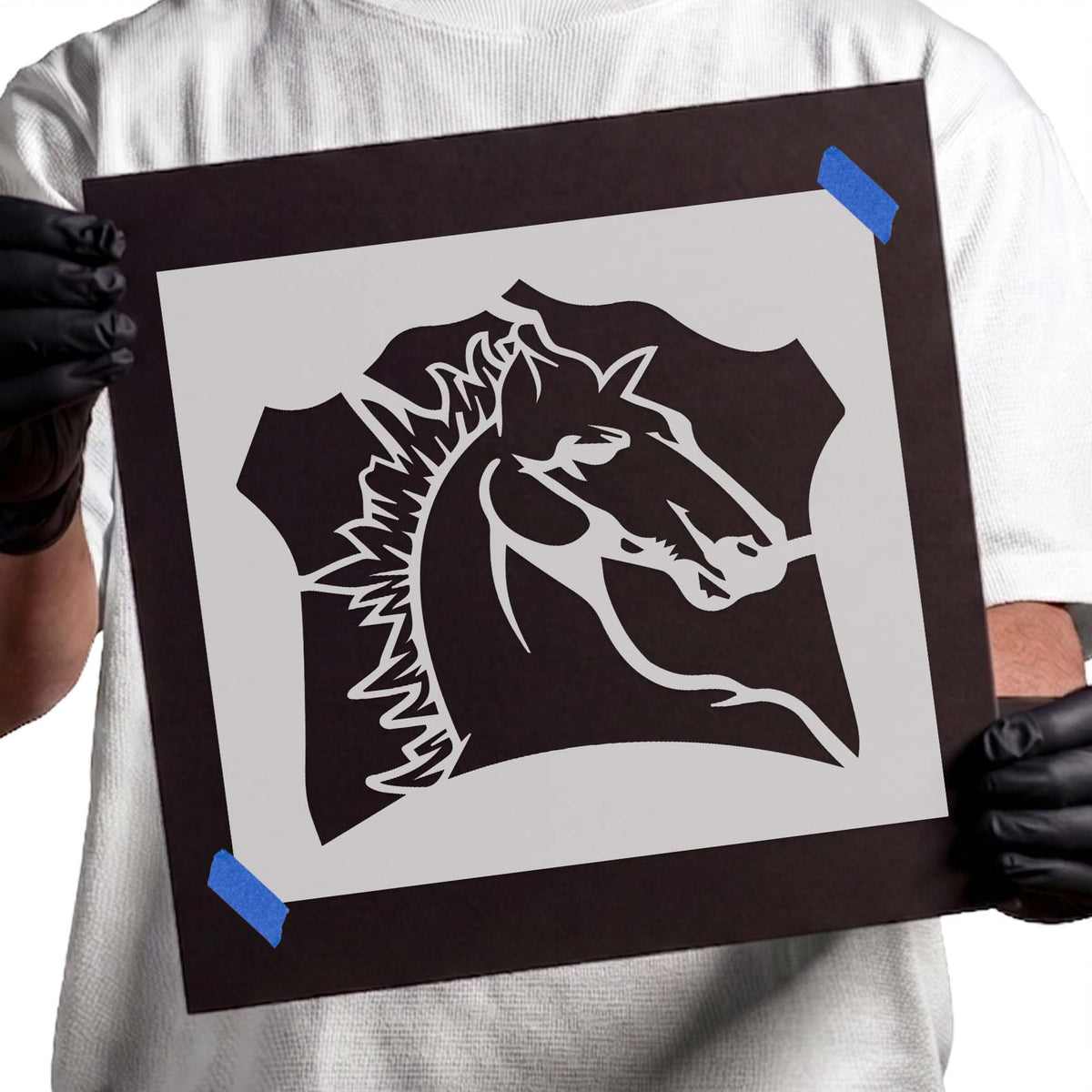 Horse head stencil with a flowing spiked mane, pointed ears, and bold crest-shaped details
