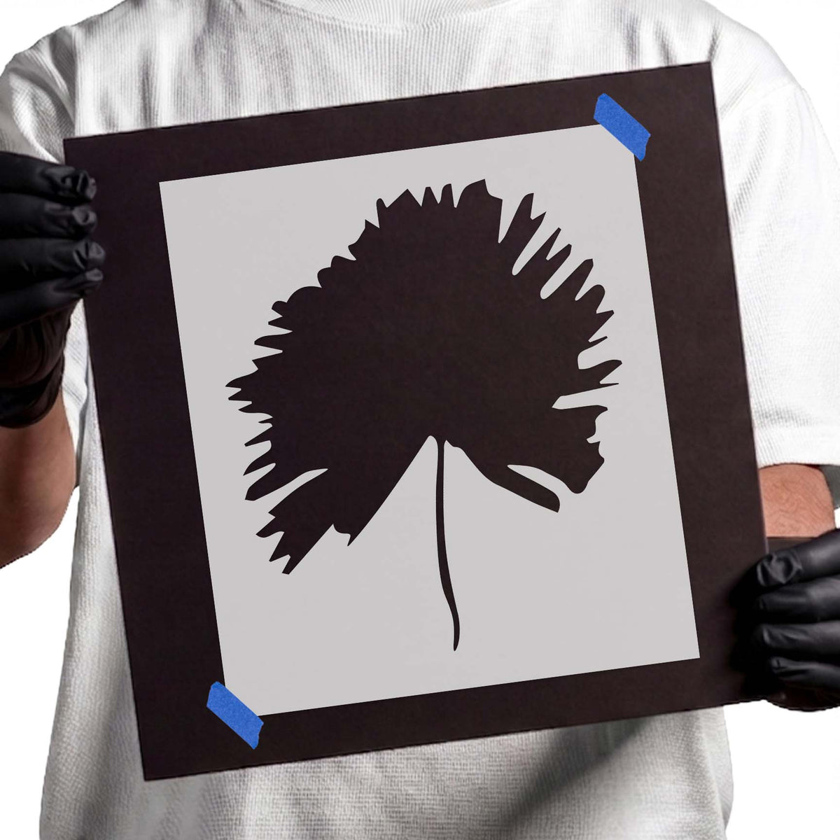 Flower stencil with jagged irregular petals and a slender curved stem