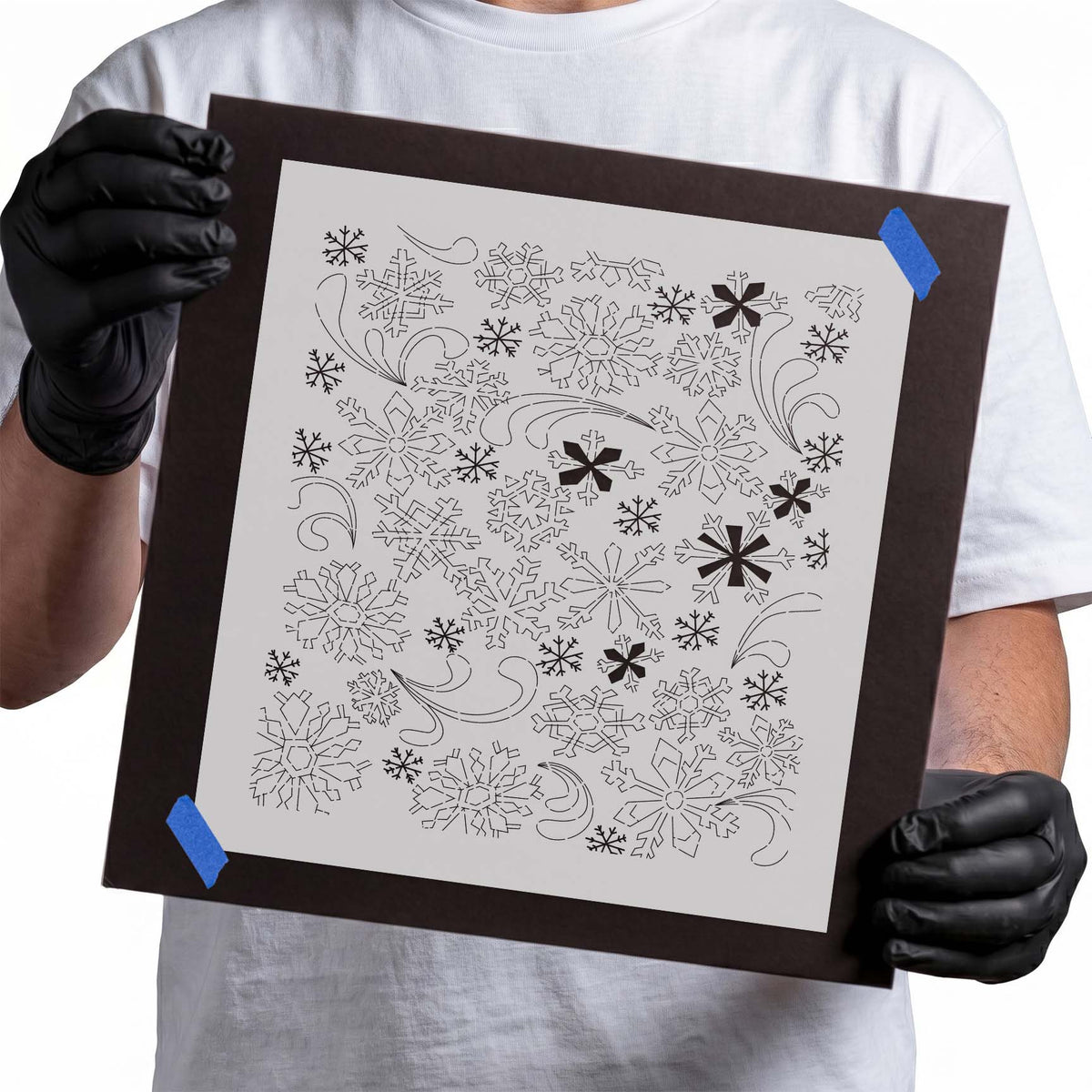 Snowflake pattern stencil featuring intricate six-pointed snowflakes, varied crystalline shapes, and swirling flourishes