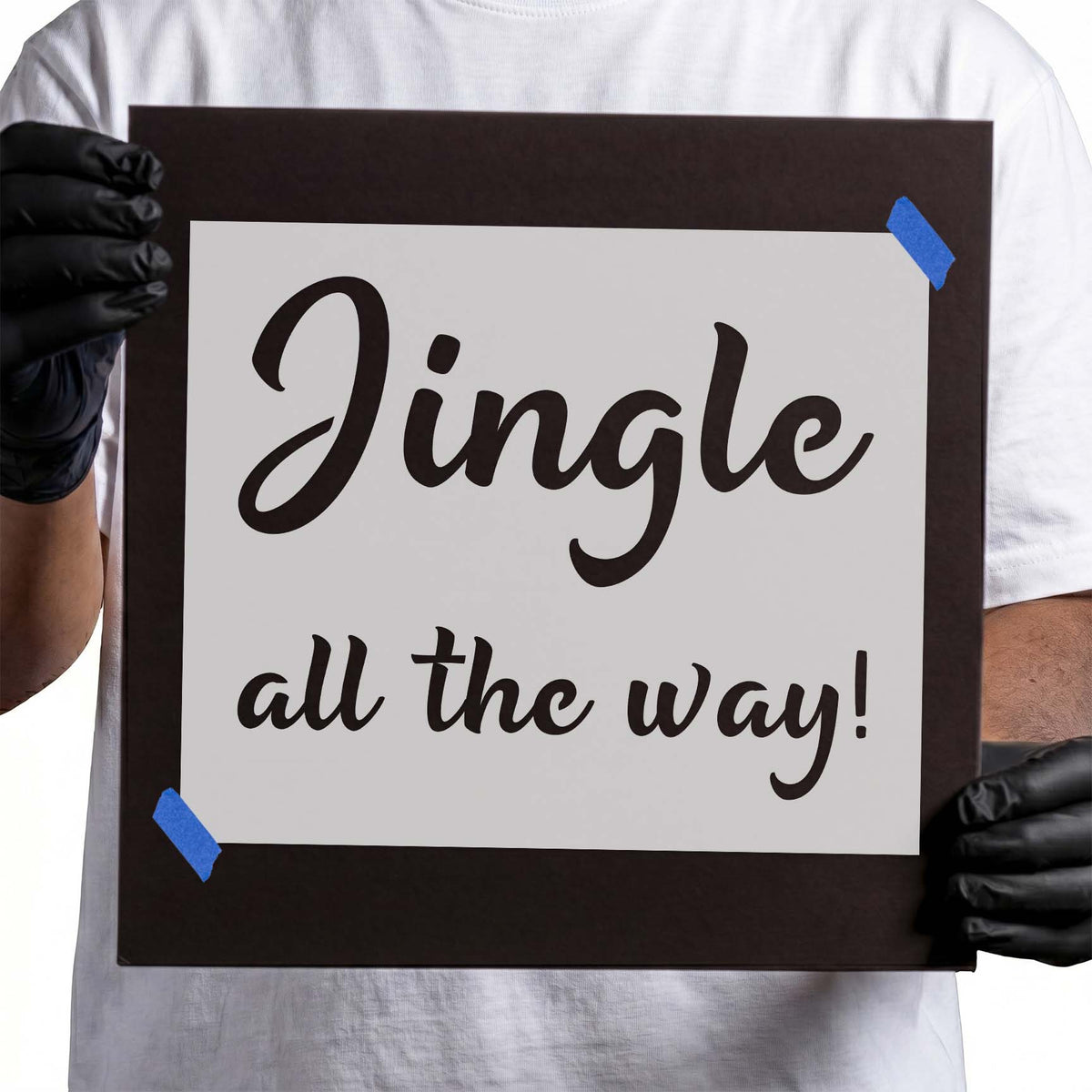 Jingle all the way stencil featuring festive cursive lettering arranged in two lines