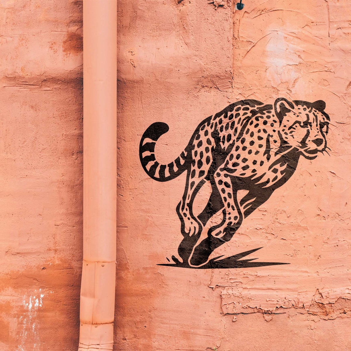 Leaping Cheetah Stencil painted in black on textured salmon wall