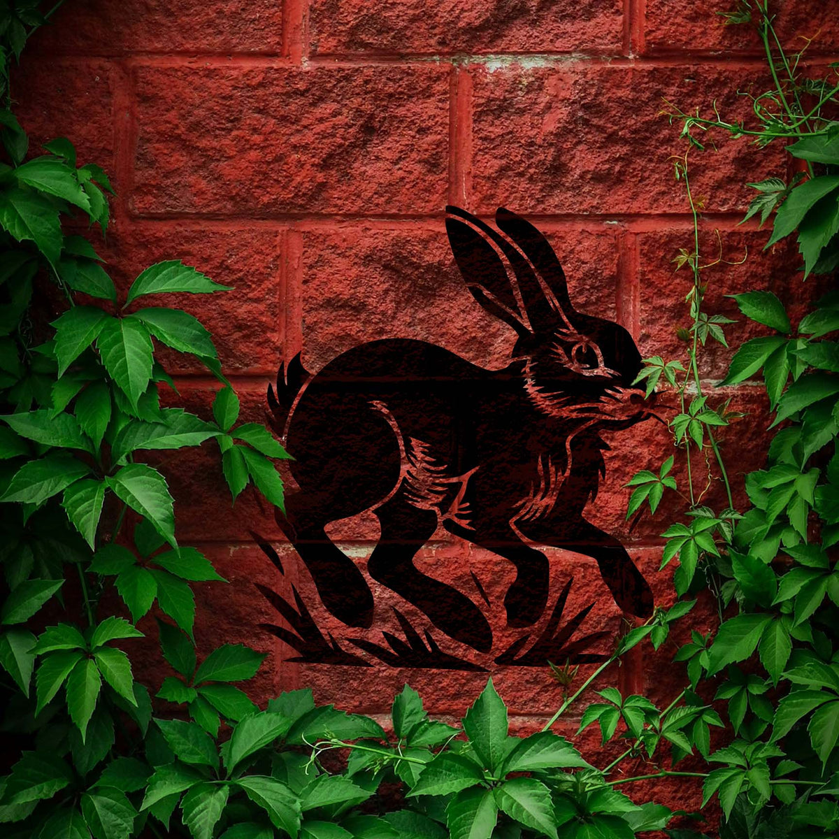 Leaping Rabbit Stencil bounding across a red brick wall framed by green vines