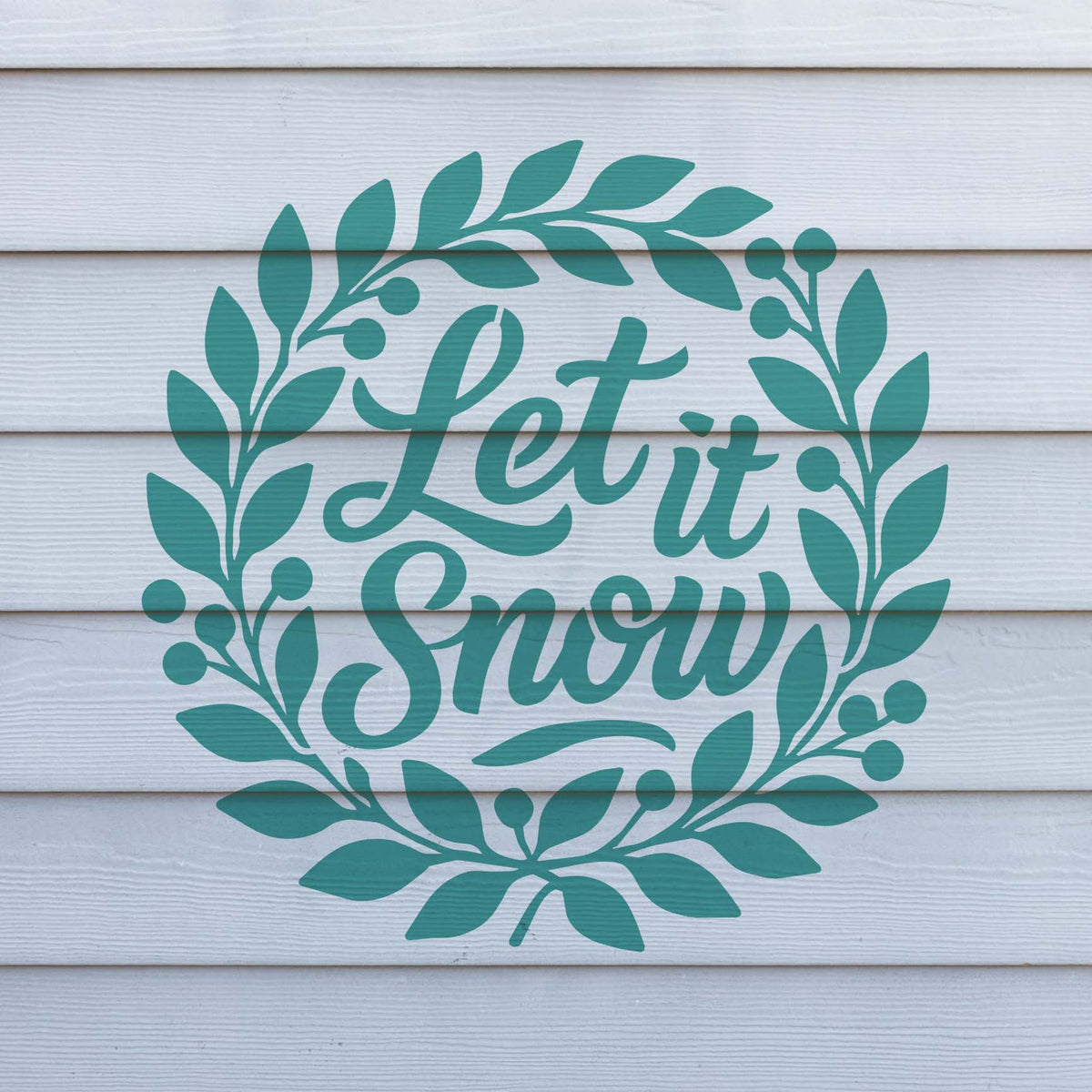 Teal Let It Snow Holiday Wreath Stencil adds leafy branches and berries to white exterior siding.