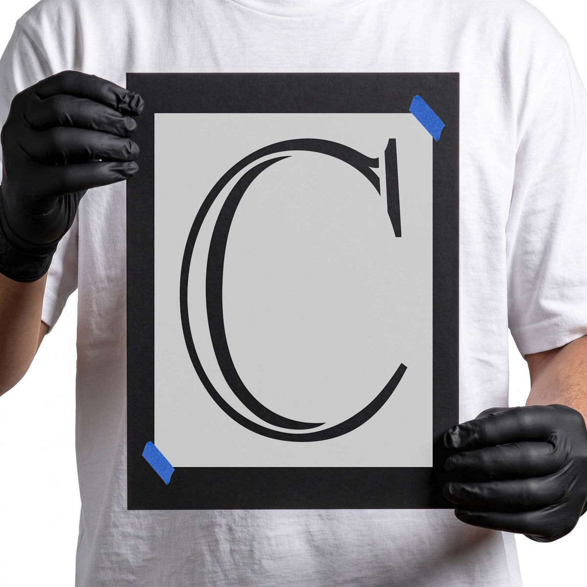 Uppercase letter C stencil featuring elegant double-line curves and decorative serif accents