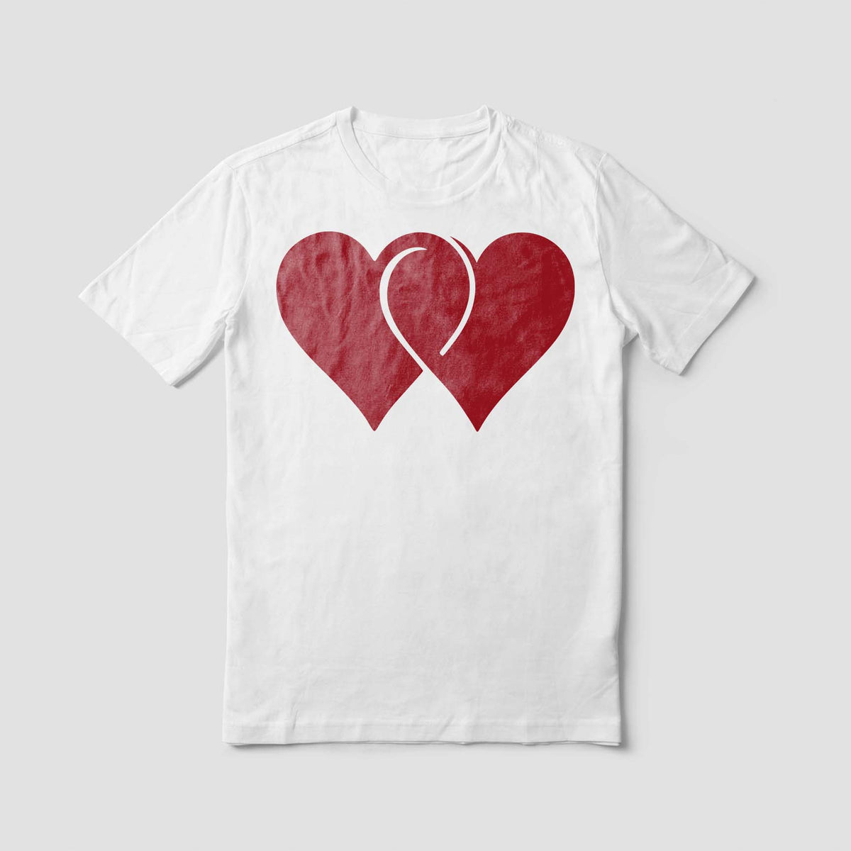 A white T-shirt features the Linked Hearts Stencil with two overlapping red heart shapes