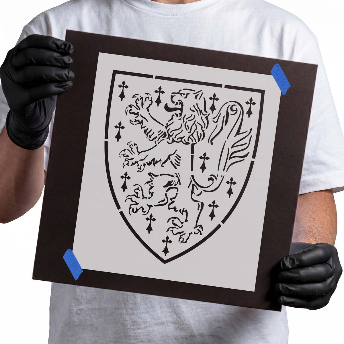 Lion rampant shield stencil with heraldic lion, ornate motif, and scattered symbols