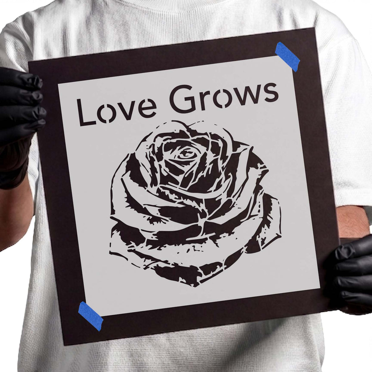Love Grows lettering above a detailed blooming rose stencil