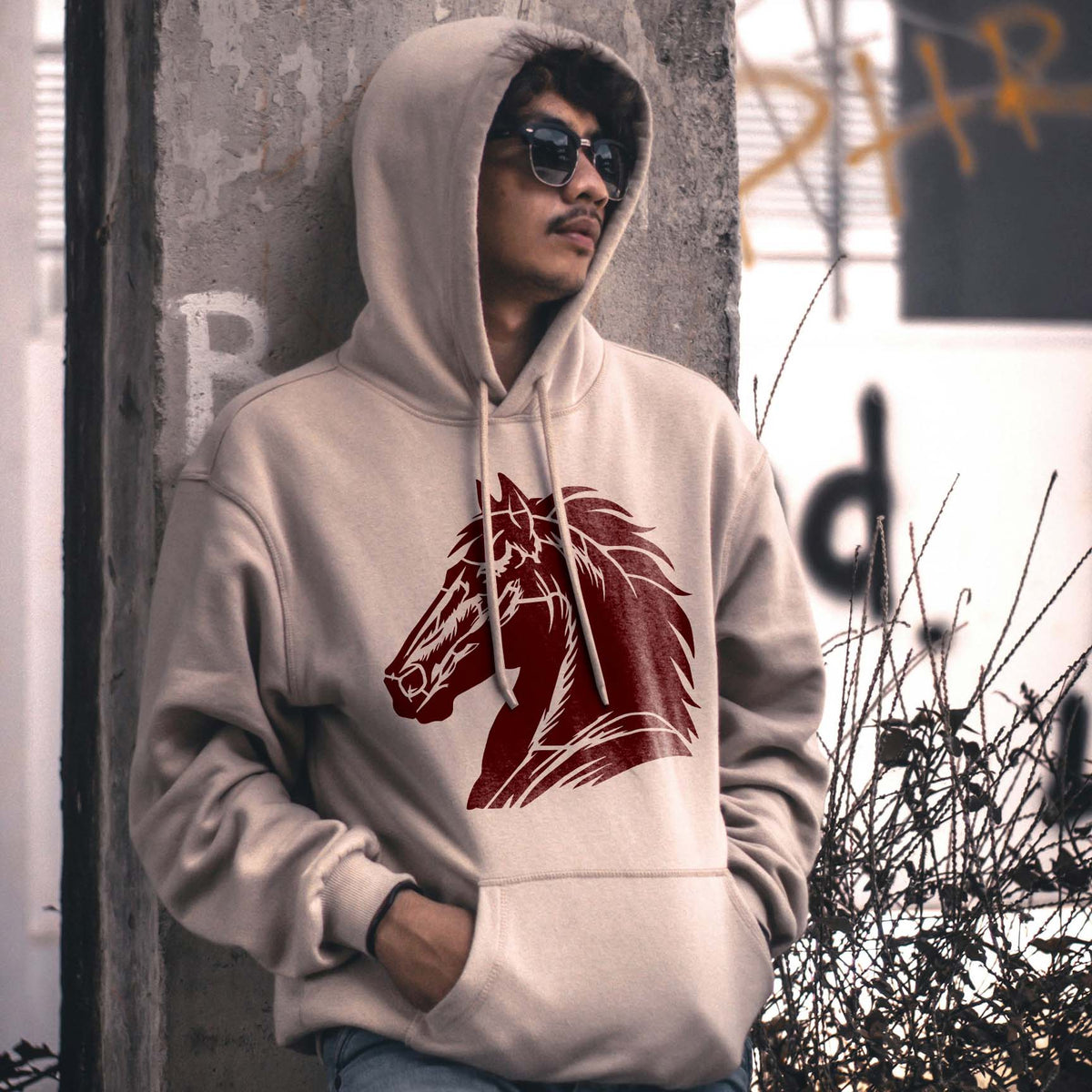 A beige hoodie displays the Majestic Horse Head Stencil with a bold bridled horse and flowing mane.
