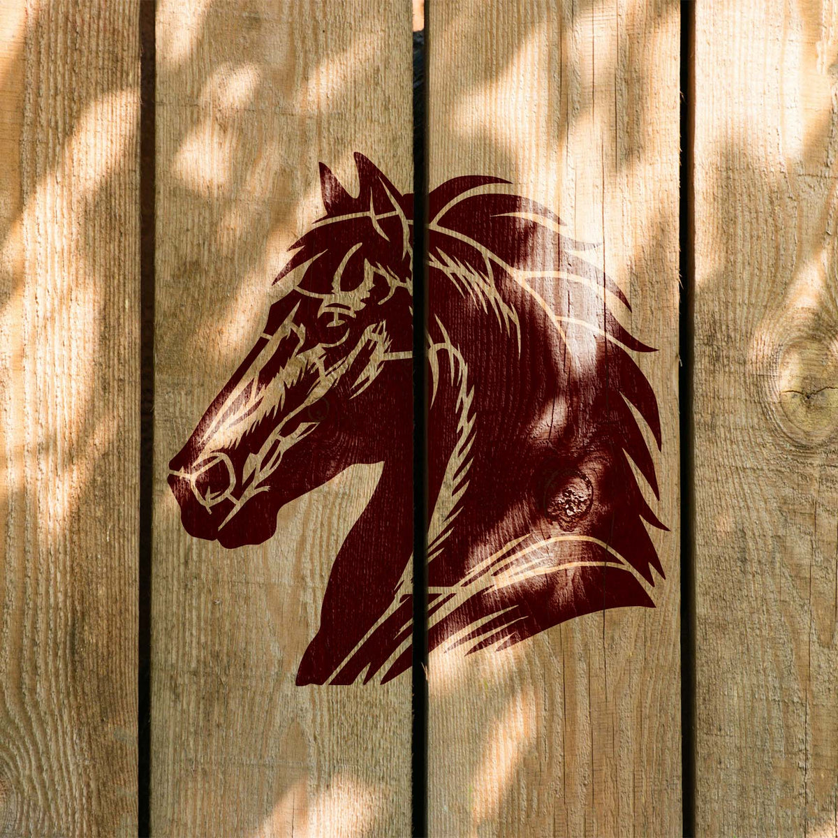 Painted across rustic wood, the Majestic Horse Head Stencil features a striking horse profile with flowing mane.