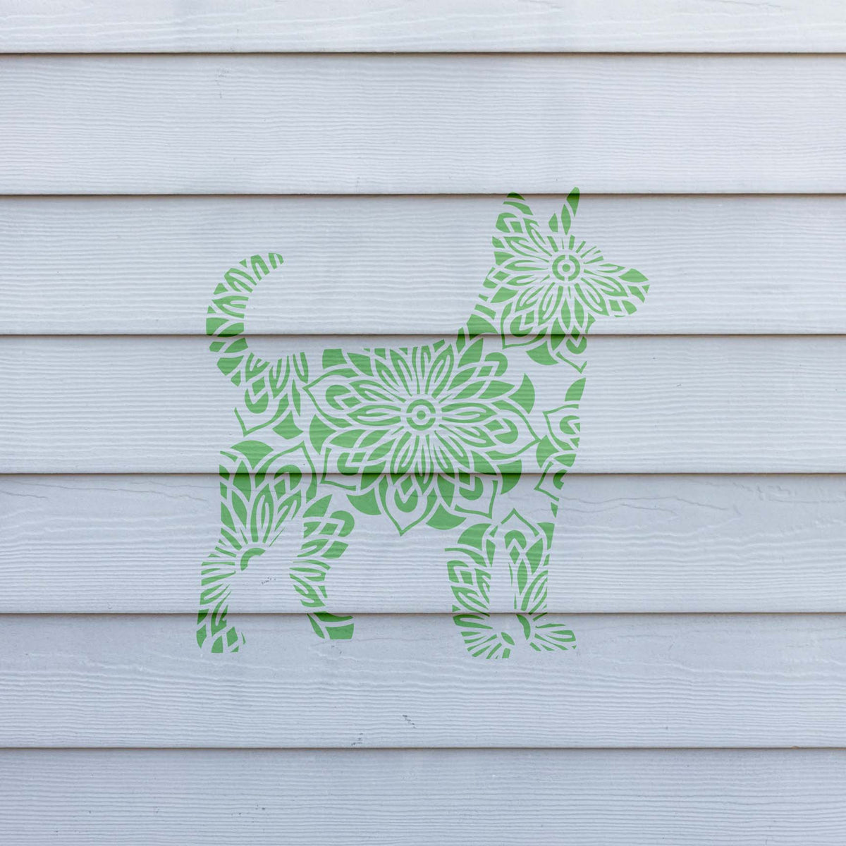 Fresh green Mandala Floral Dog Silhouette Stencil adds ornate floral detail to white siding