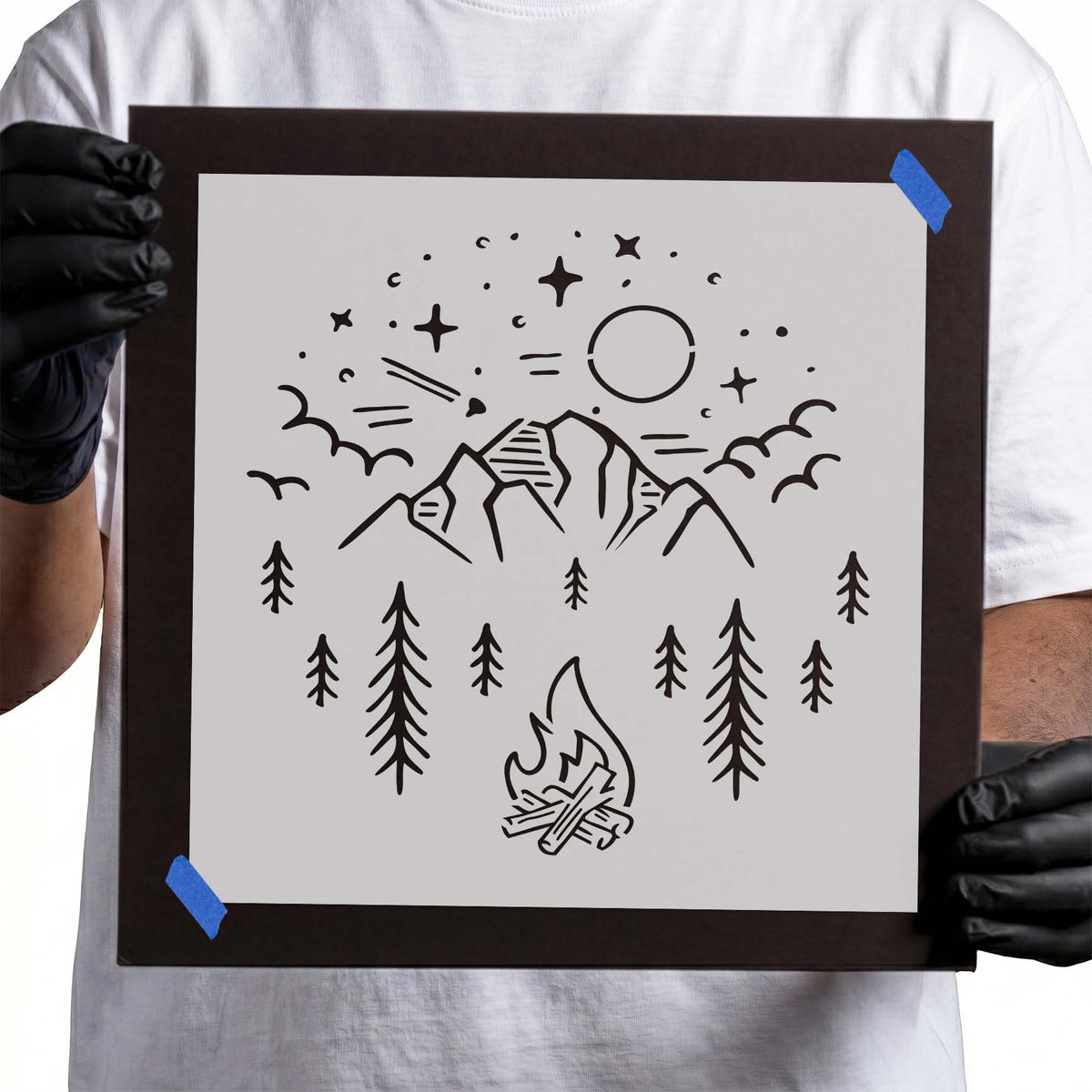 Mountain campfire stencil with pine trees, peaks, stars, sun, and birds