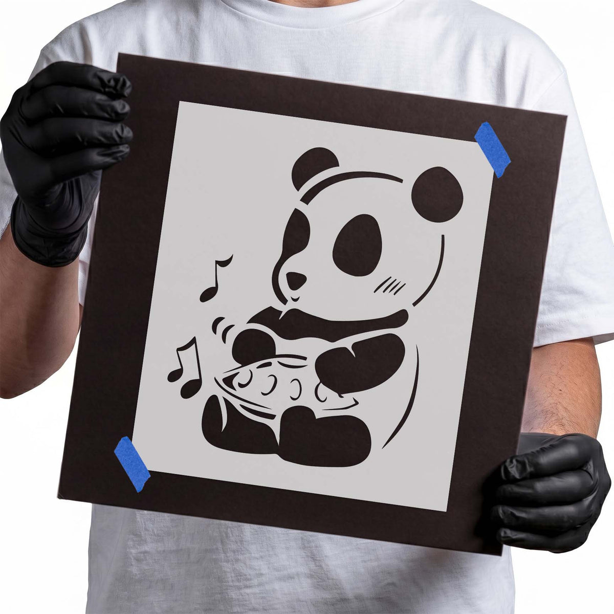 Panda stencil holding a fish with playful musical notes