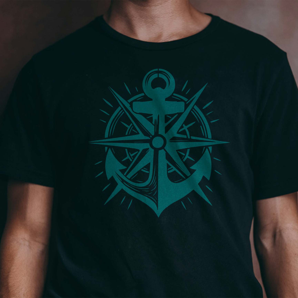 Teal Nautical Anchor Compass Rose Stencil creates a striking maritime graphic on a black shirt