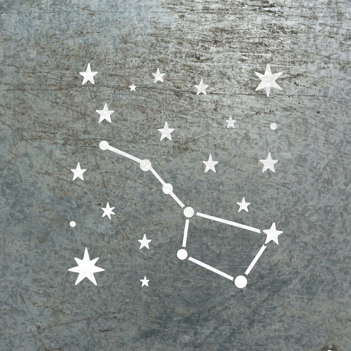 Scattered stars and the Northern Star Constellation Stencil stand out in white on weathered metal