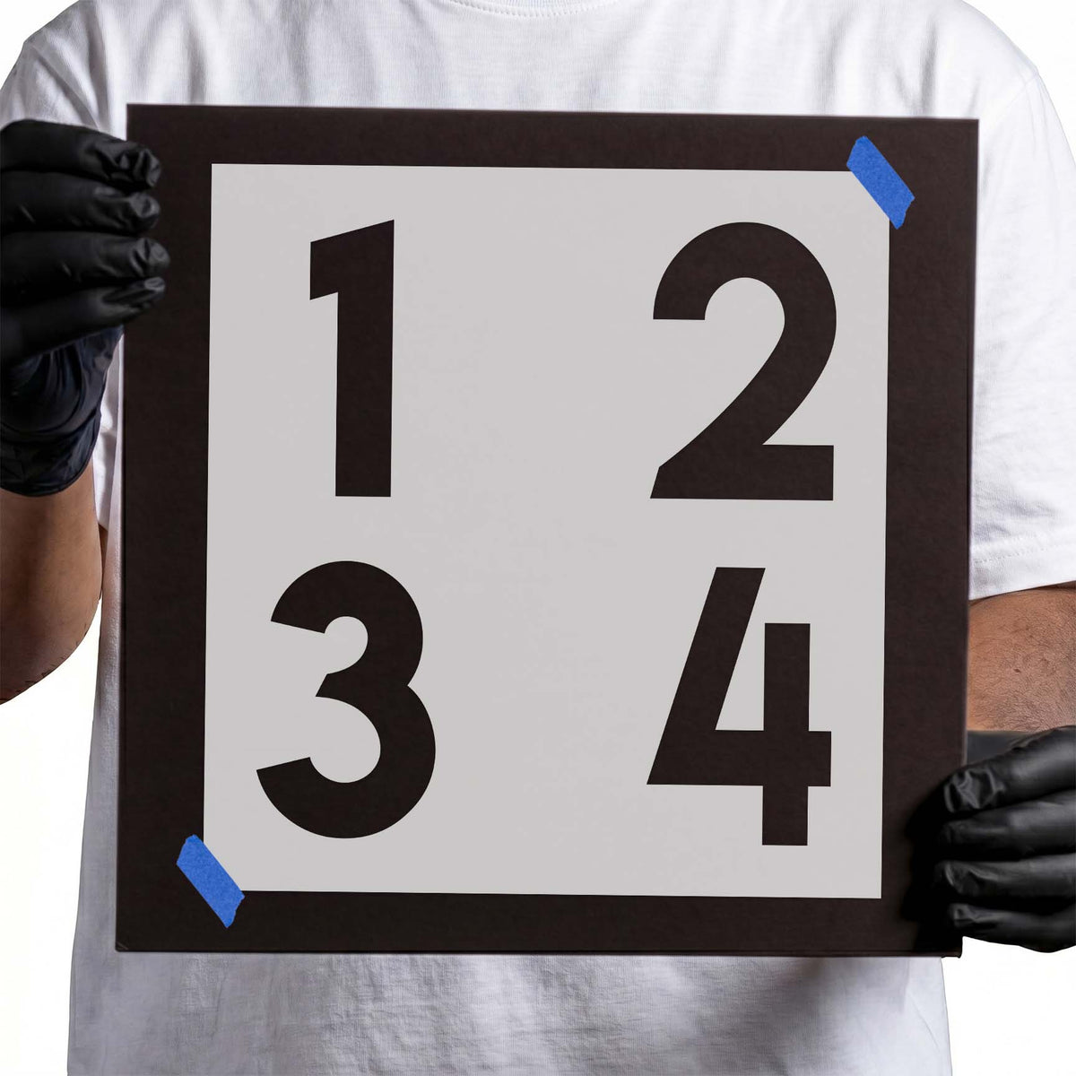 Numbers 1-4 stencil featuring four bold block numerals arranged in two rows