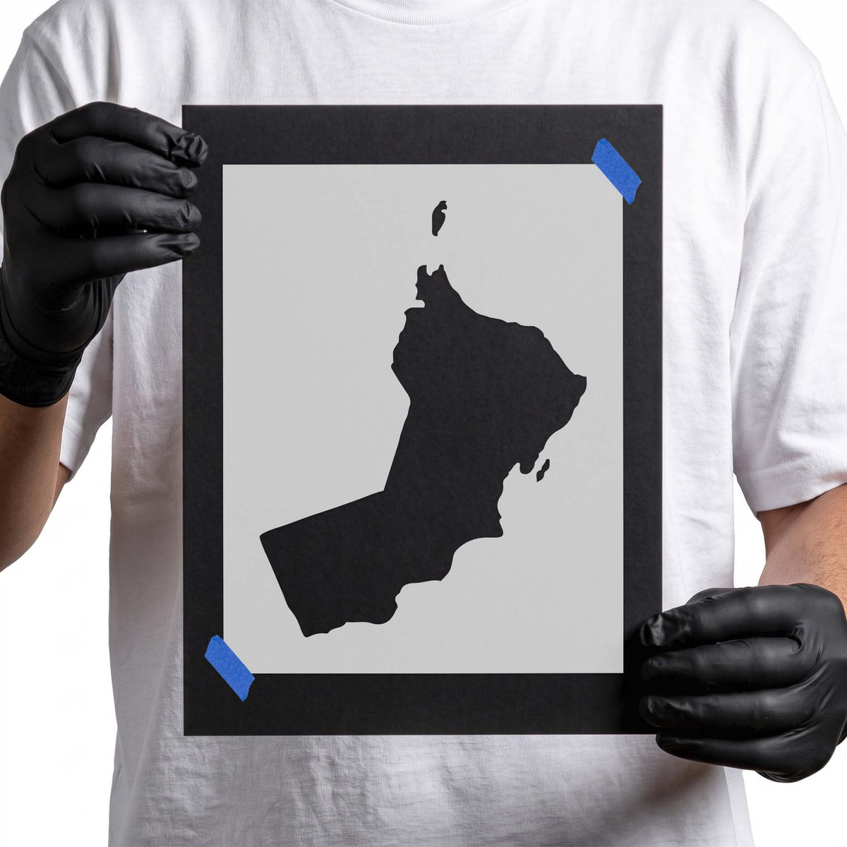 Oman stencil featuring a solid country silhouette with irregular coastlines and detached geographical details