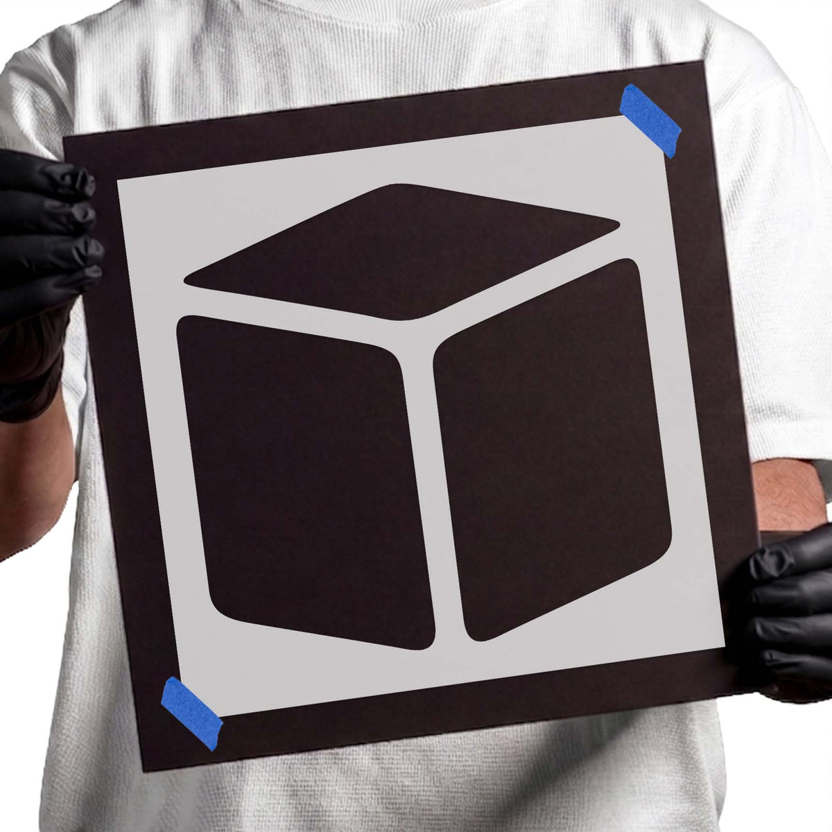 Geometric cube stencil featuring three solid faces with rounded corners and dimensional perspective