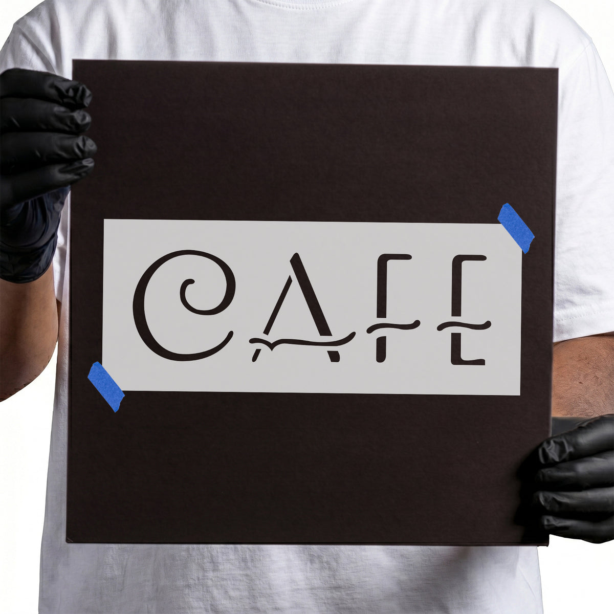 Ornate Cafe Sign Text Stencil with a spiral C and decorative lettering displayed on a white stencil sheet