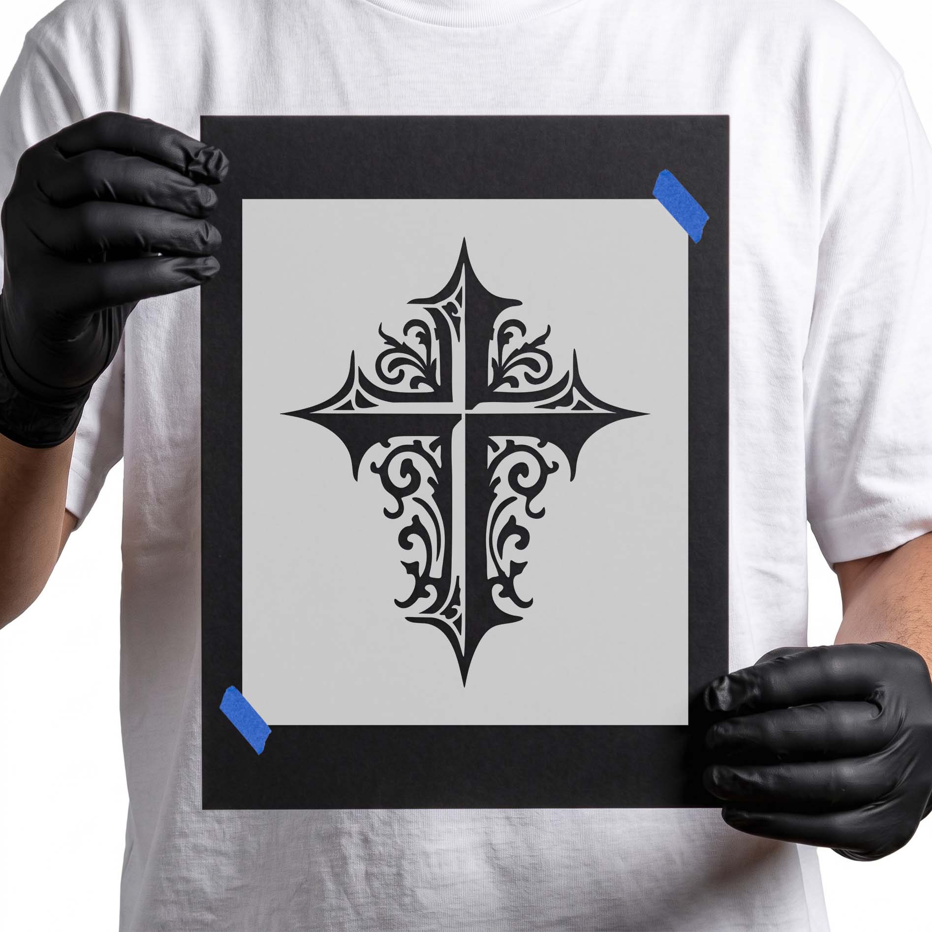 Gothic cross stencil with pointed edges and ornate scrollwork details
