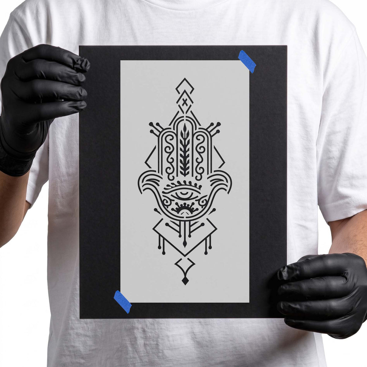 Ornate Hamsa hand stencil with central eye and intricate geometric details