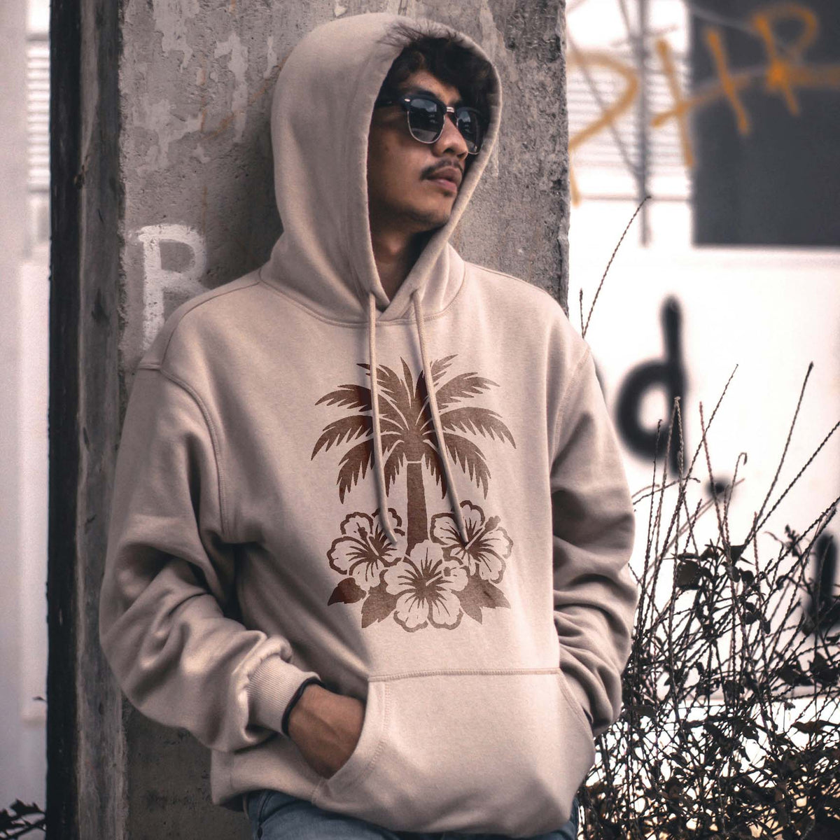 Palm Tree and Hibiscus Flowers Stencil printed on a beige hooded sweatshirt