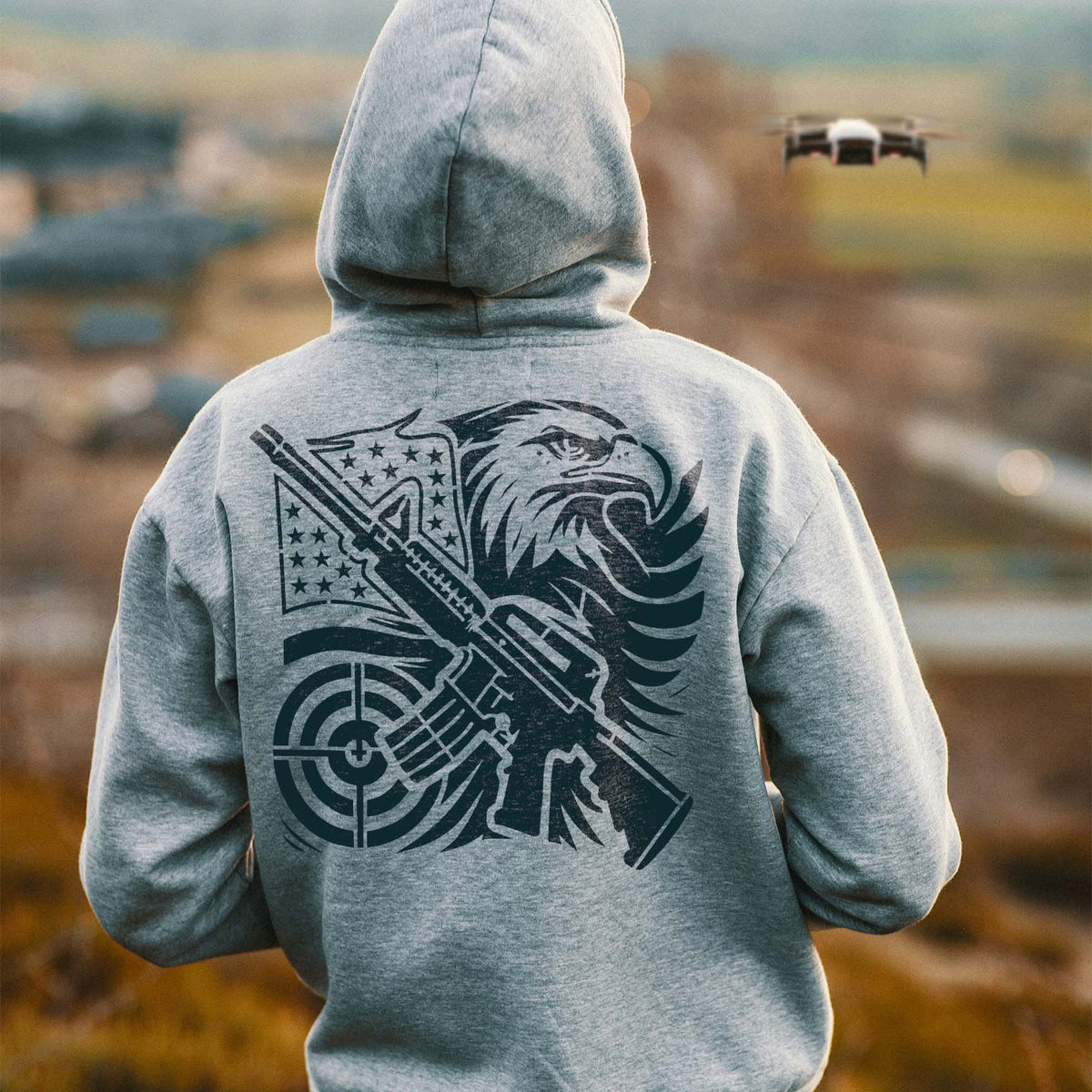 Patriotic Eagle and Rifle Stencil printed on a gray hoodie with a bold eagle, flag, and target design