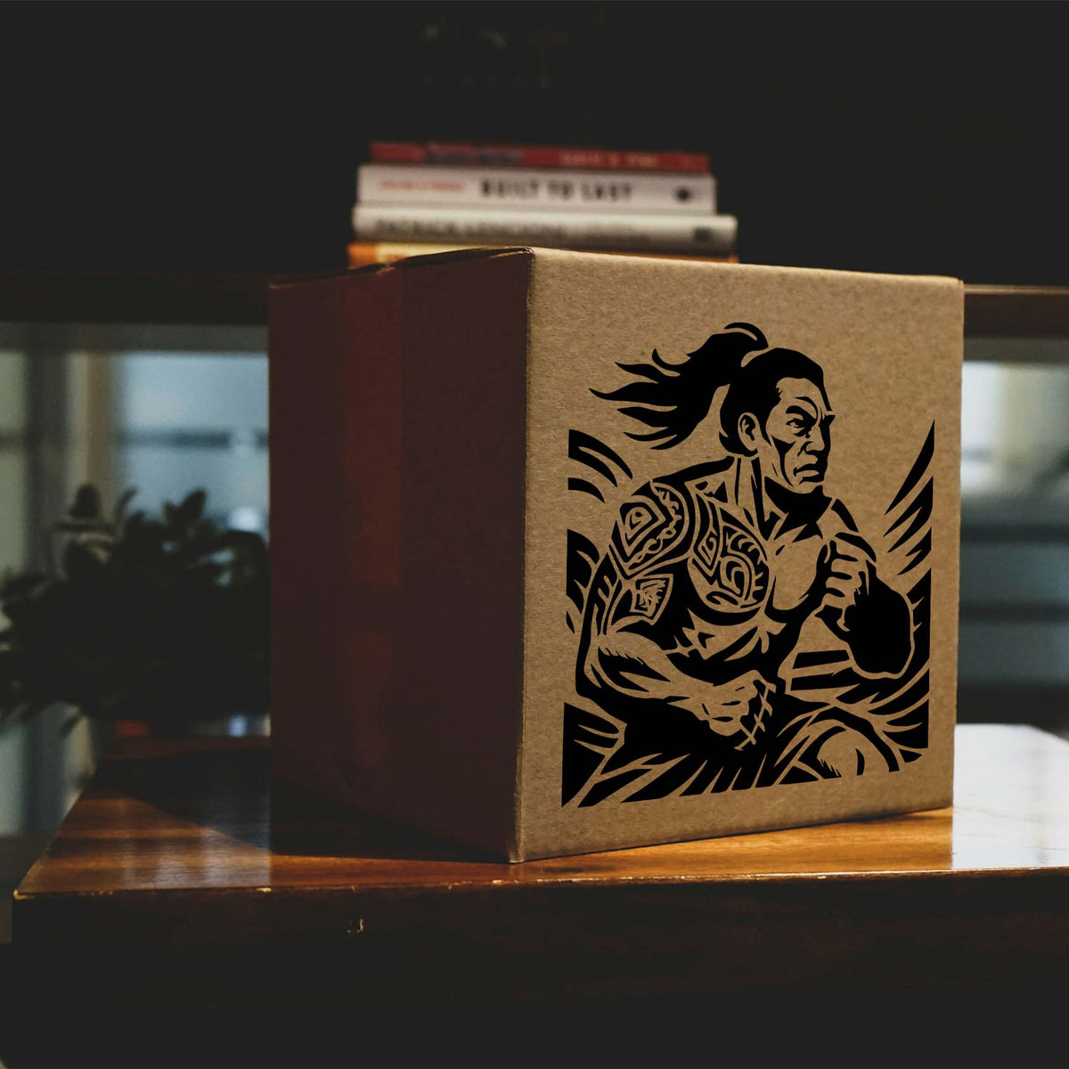 Polynesian Warrior Stencil in black on a cardboard box with tribal tattoo details.