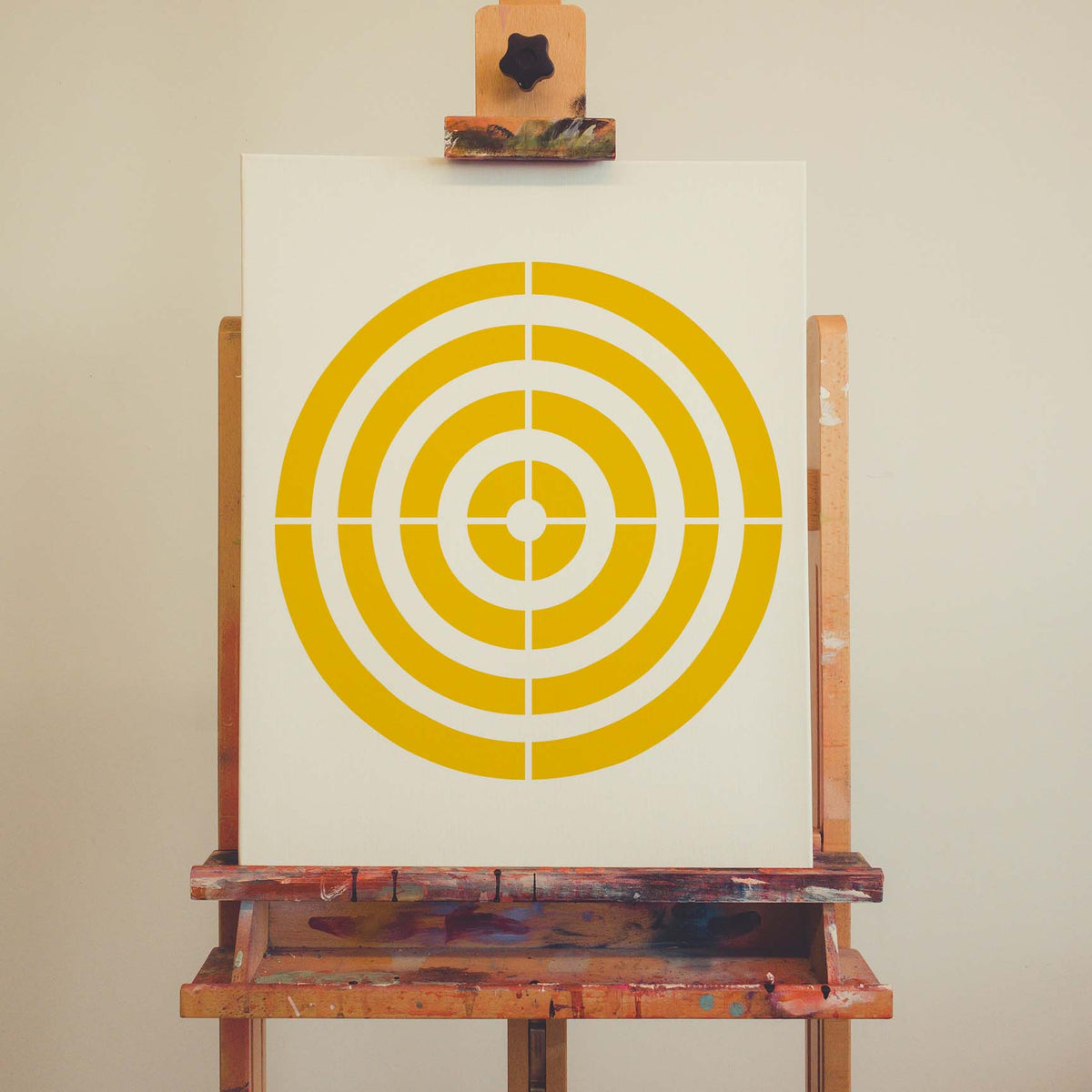 Precision Concentric Target Stencil forms crisp yellow rings on an artist canvas