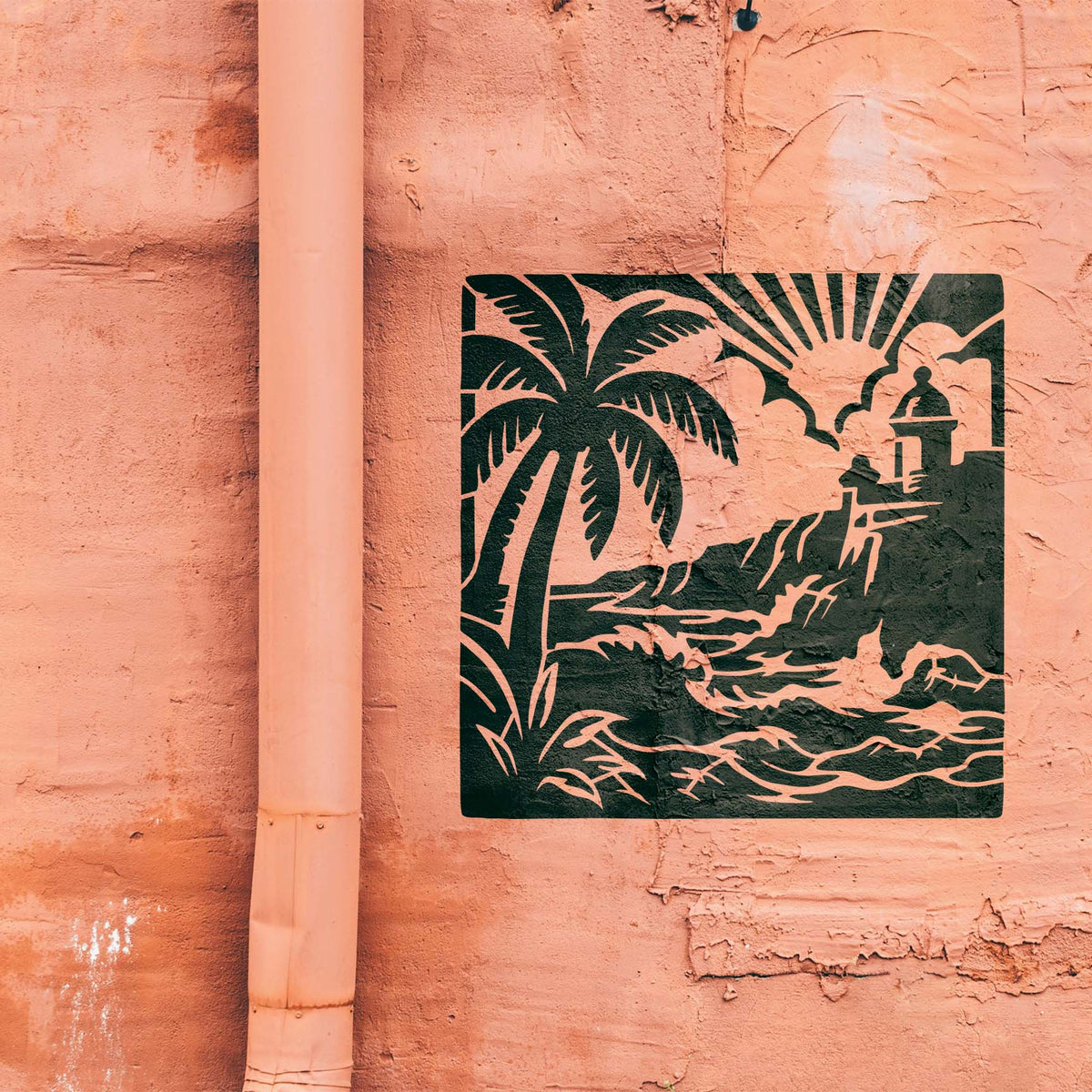 Coastal waves and fortress from the Puerto Rico Coastal Fortress Stencil decorate a salmon textured wall