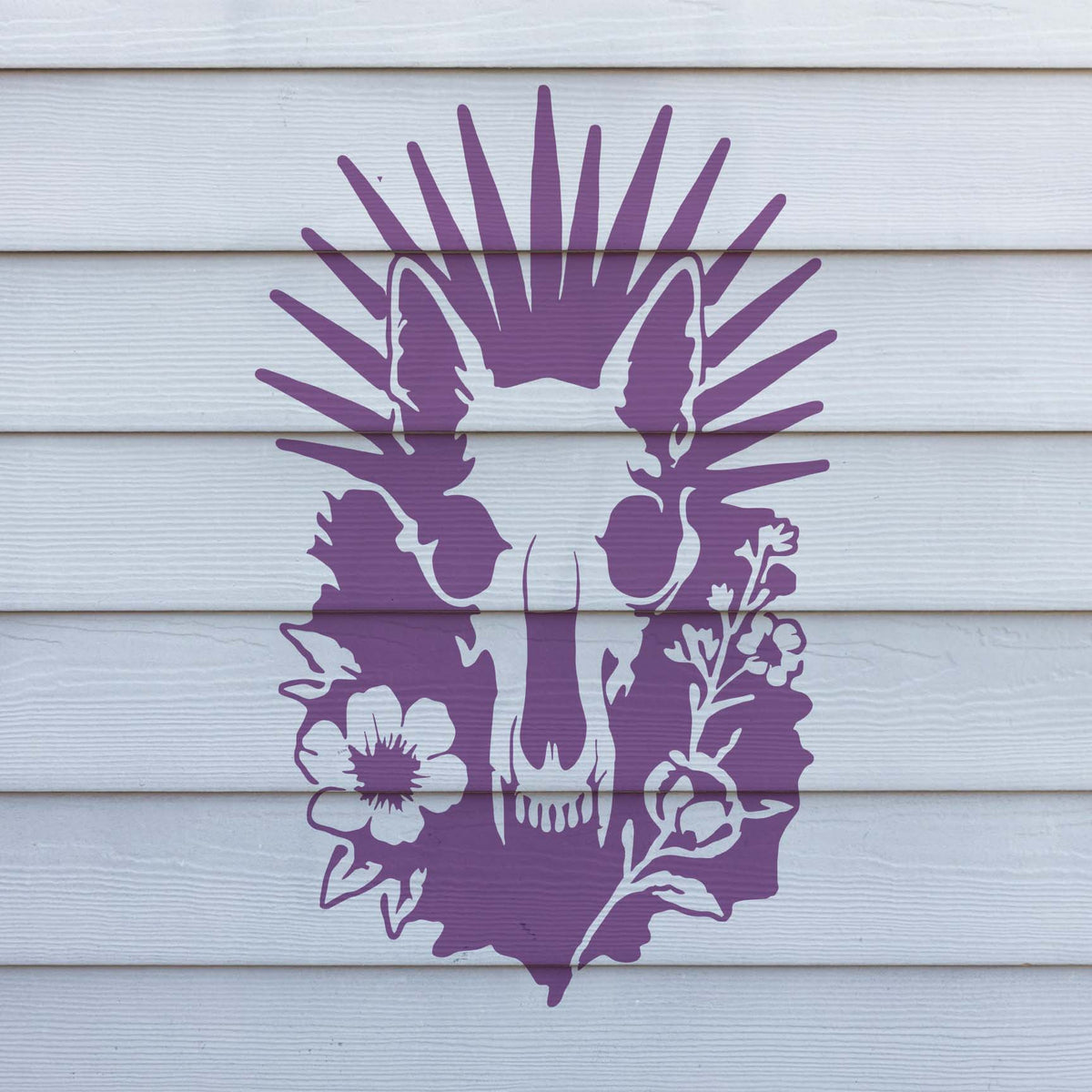 Purple Radiant Animal Skull and Wildflower Stencil artwork painted across white wood siding