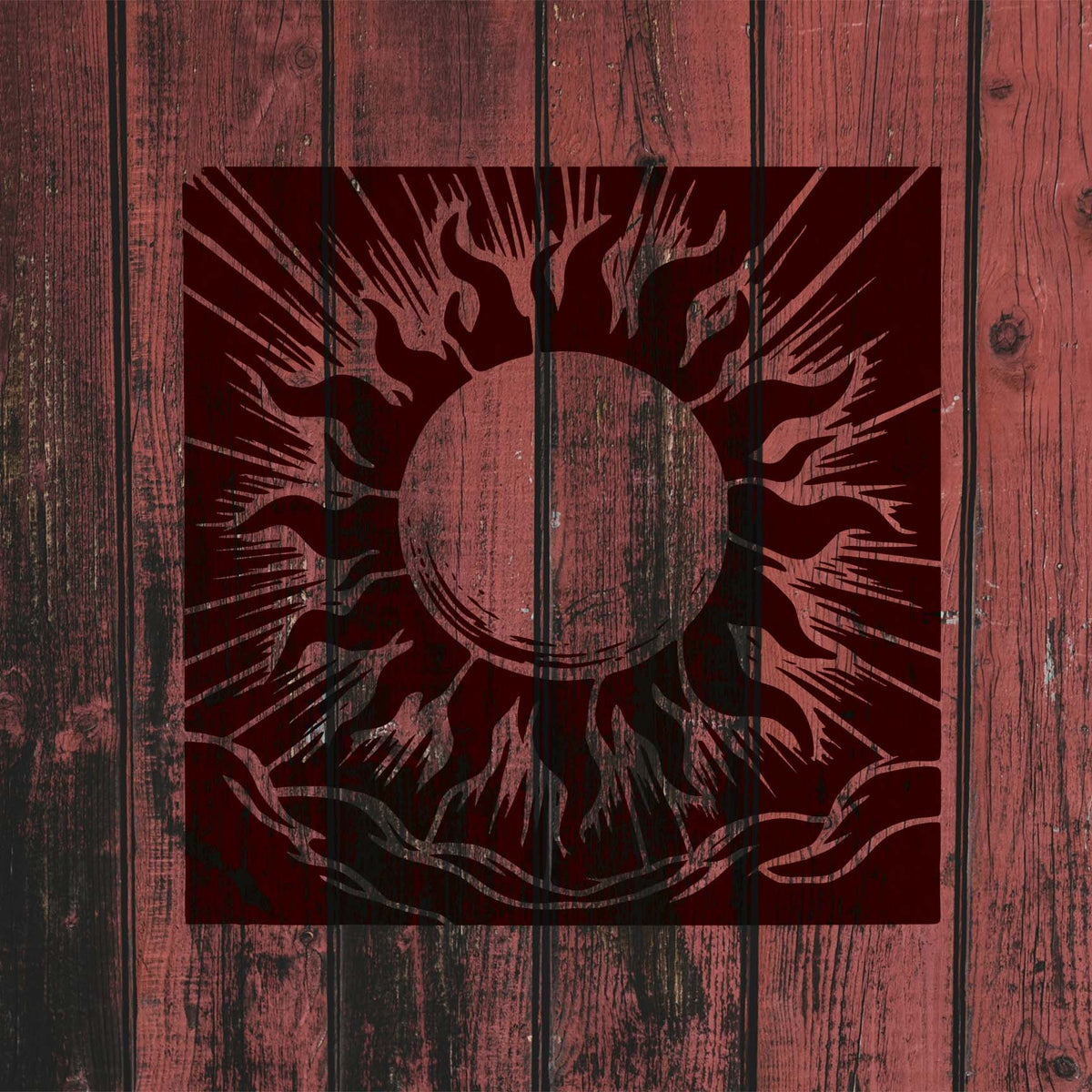 Fiery Radiant Solar Halo Stencil spreads dramatic sun rays over rustic red wood