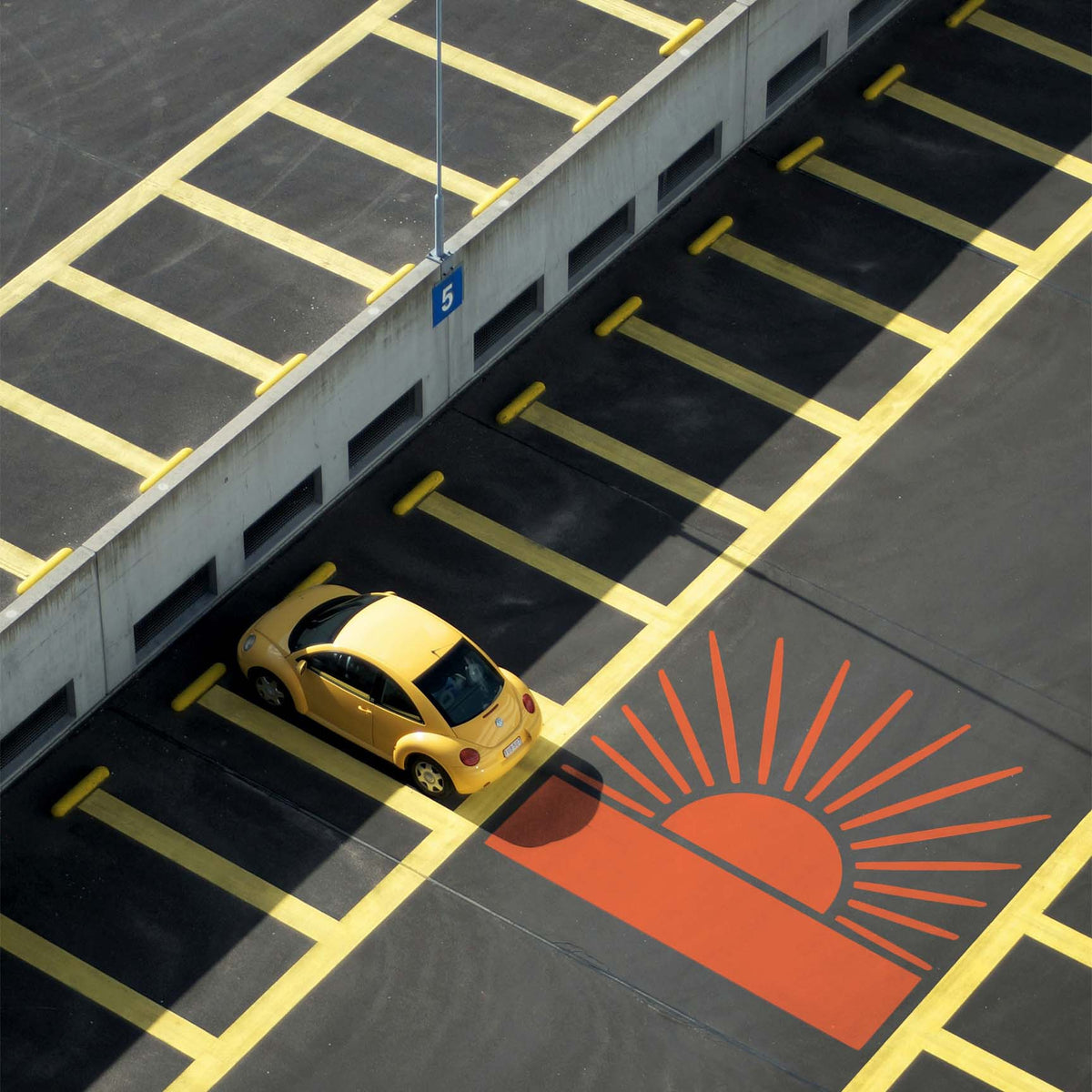 Brightening the asphalt, the Radiant Sunrise Horizon Stencil adds an orange sunburst beside a yellow car.