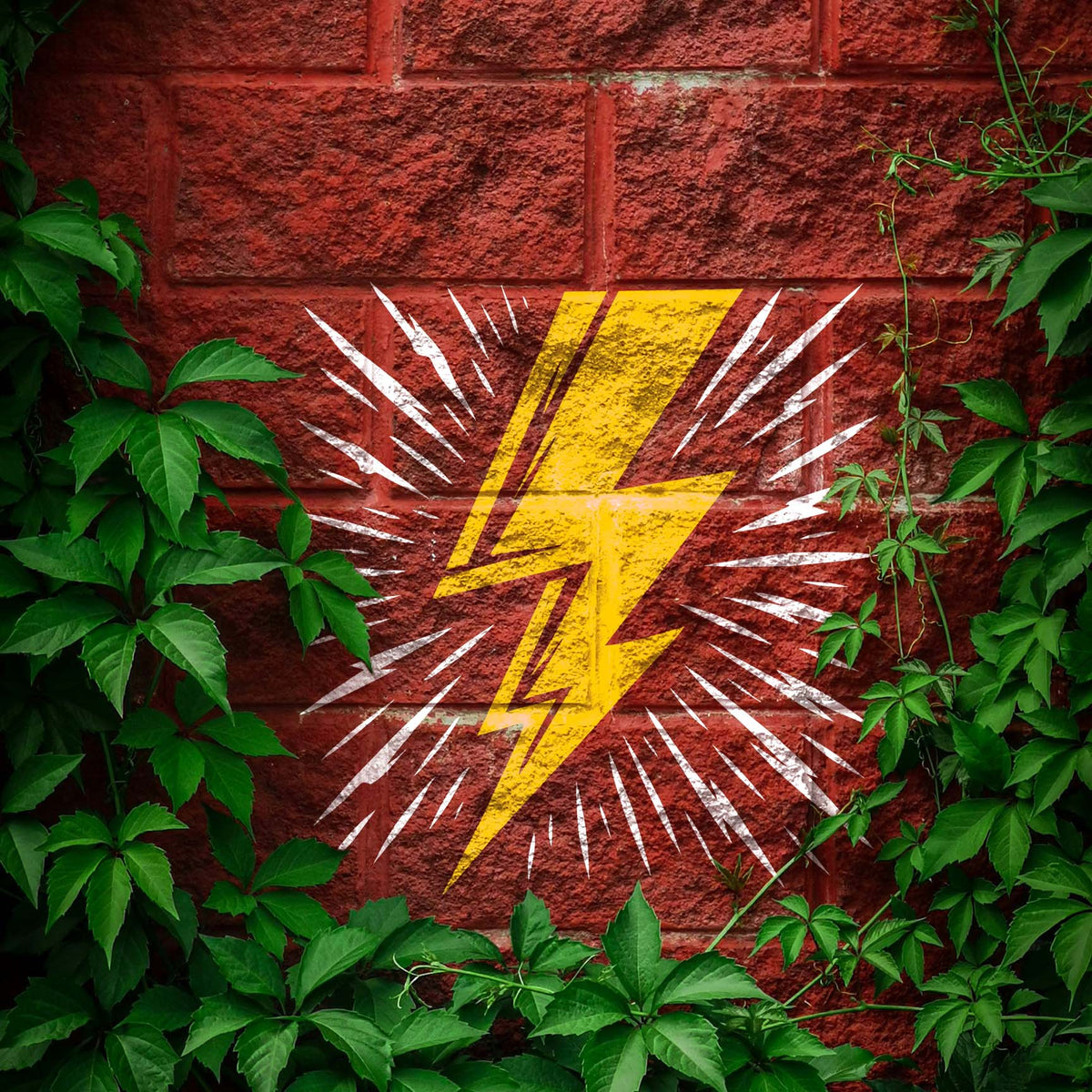 Vivid Radiating Lightning Bolt Stencil strikes a red brick wall framed by green climbing vines