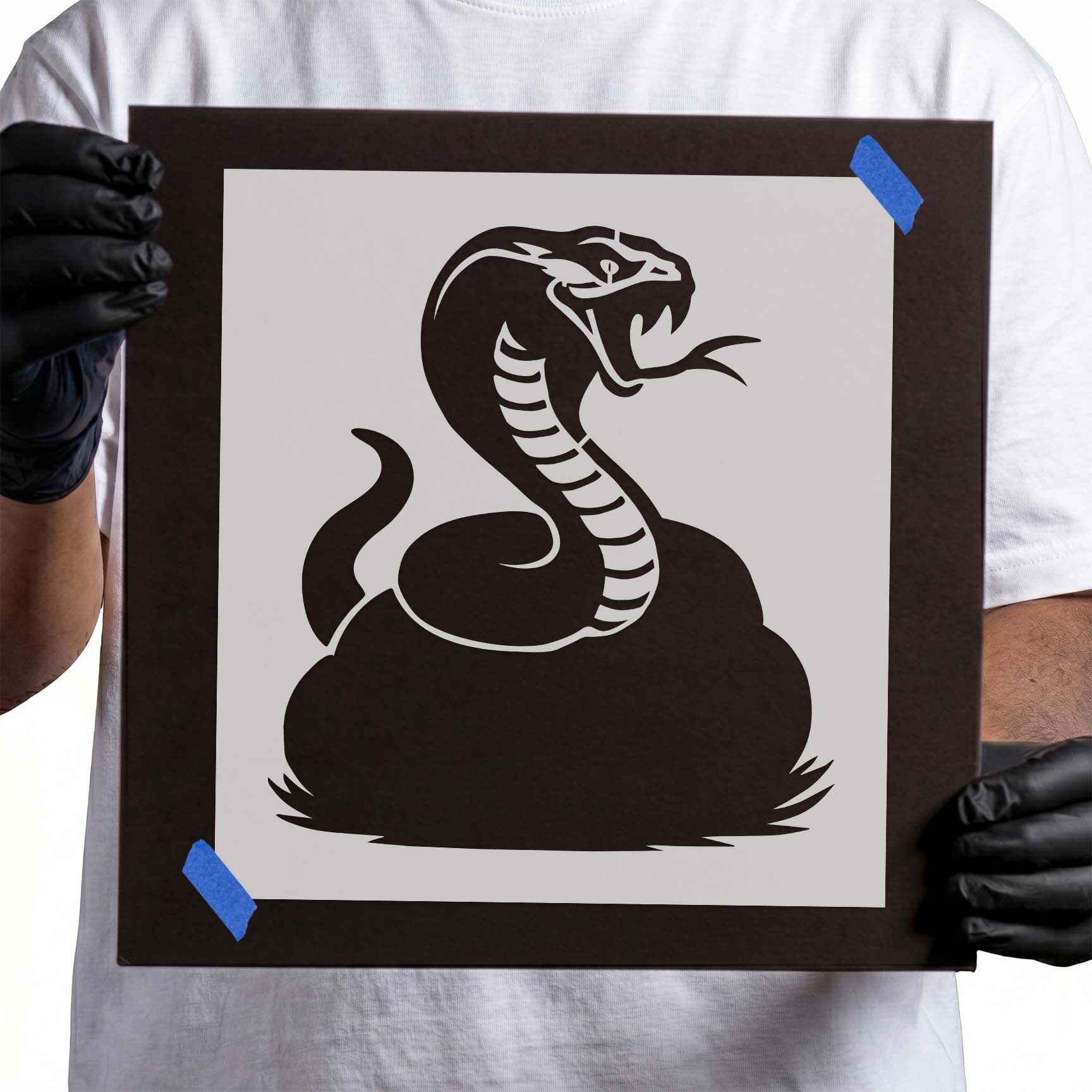 Cobra stencil with flared hood, open mouth, tongue, and coiled body