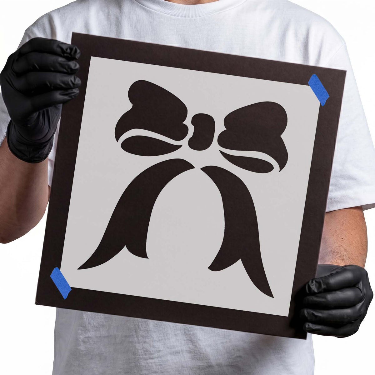 Ribbon stencil featuring a decorative bow with rounded loops and long flowing tails