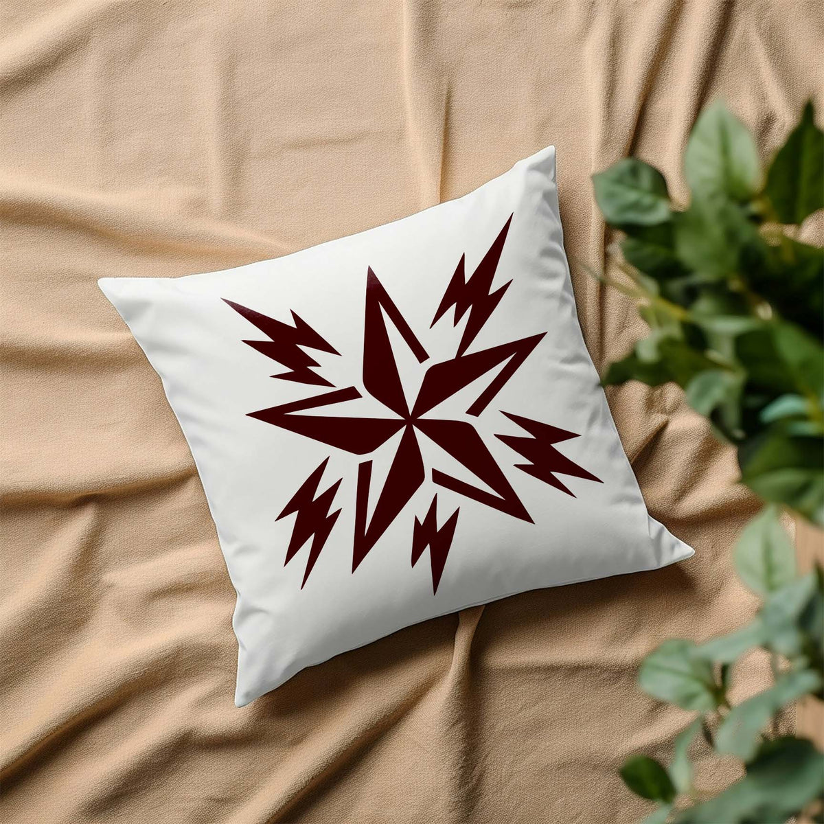 A white pillow displays the Rockstar Lightning Star Stencil with sharp surrounding bolts