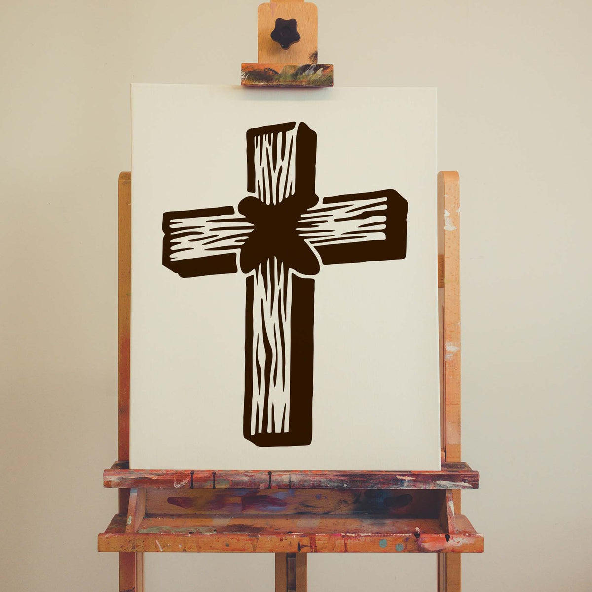 Rustic Wooden Cross Stencil displayed on a canvas easel with a brown wood-look cross design