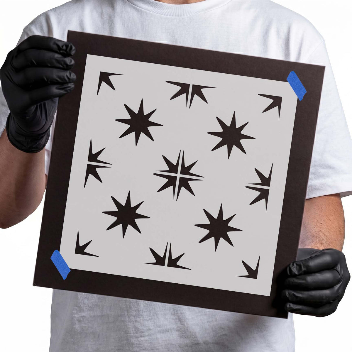 Seamless star pattern stencil with pointed starbursts and repeating edge motifs