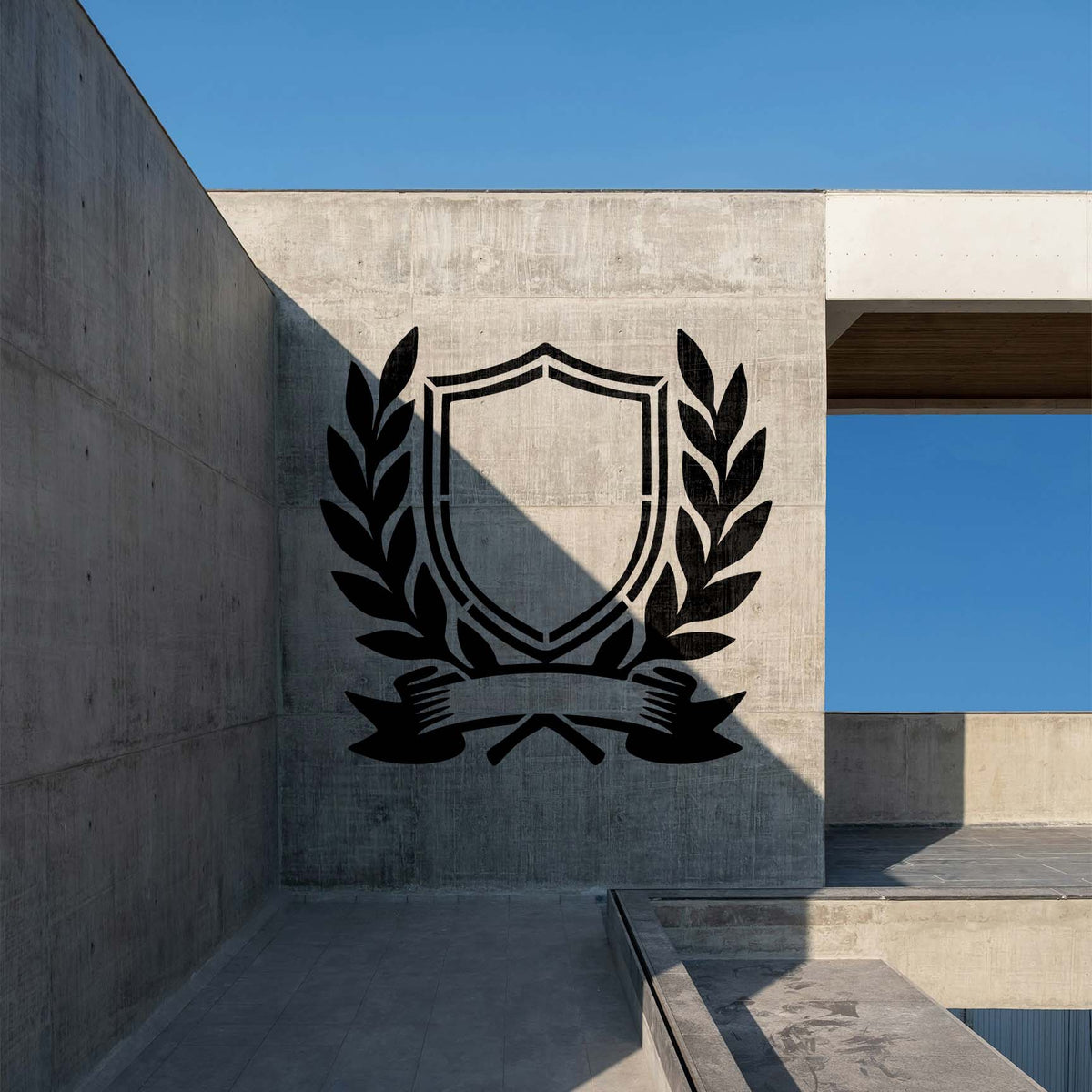 Service Crest Stencil displays a shield, laurel branches, and banner on a concrete wall