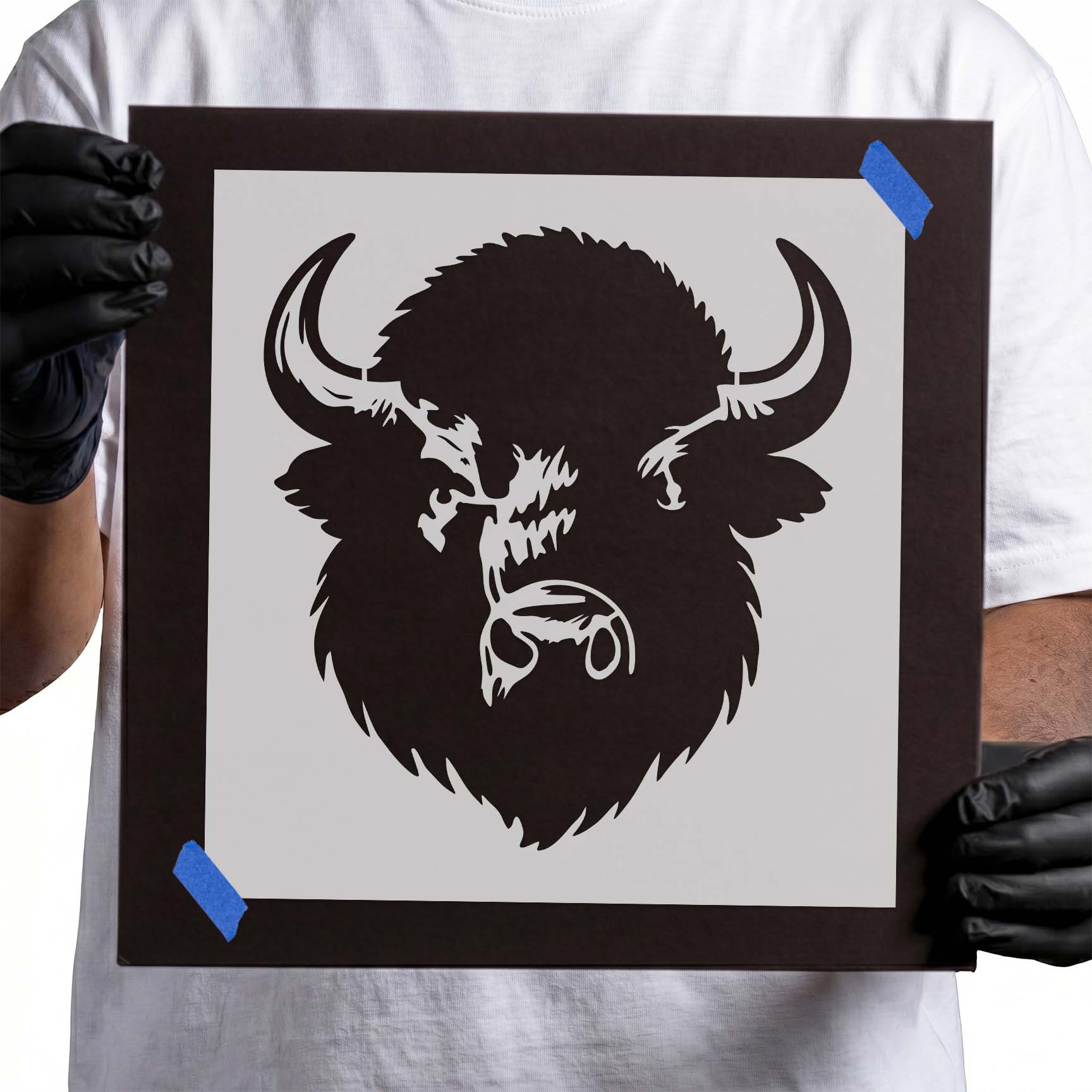 Buffalo head stencil with wide curved horns and thick shaggy mane
