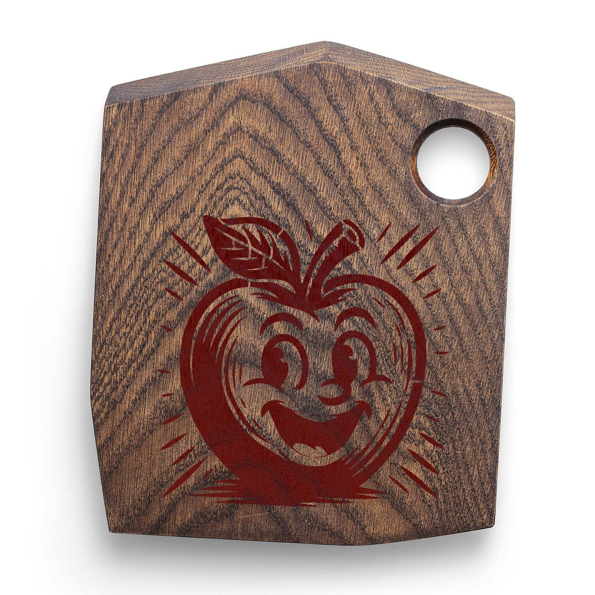 On a rustic wooden cutting board, the Smiling Cartoon Apple Character Stencil shows a playful grin.