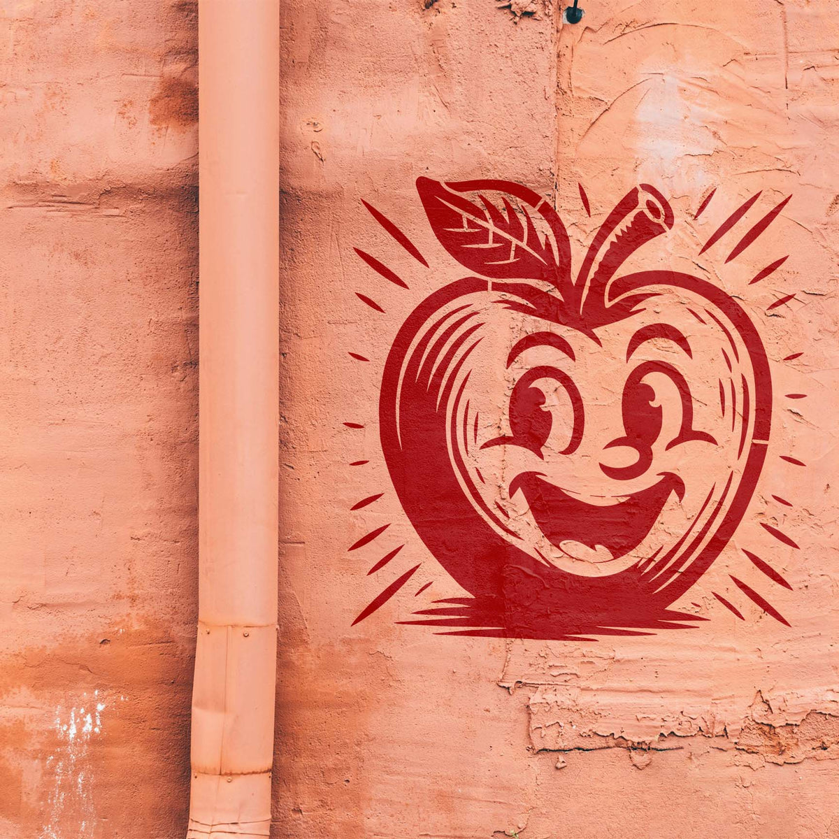 A wide-eyed Smiling Cartoon Apple Character Stencil in bold red decorates a textured peach wall.