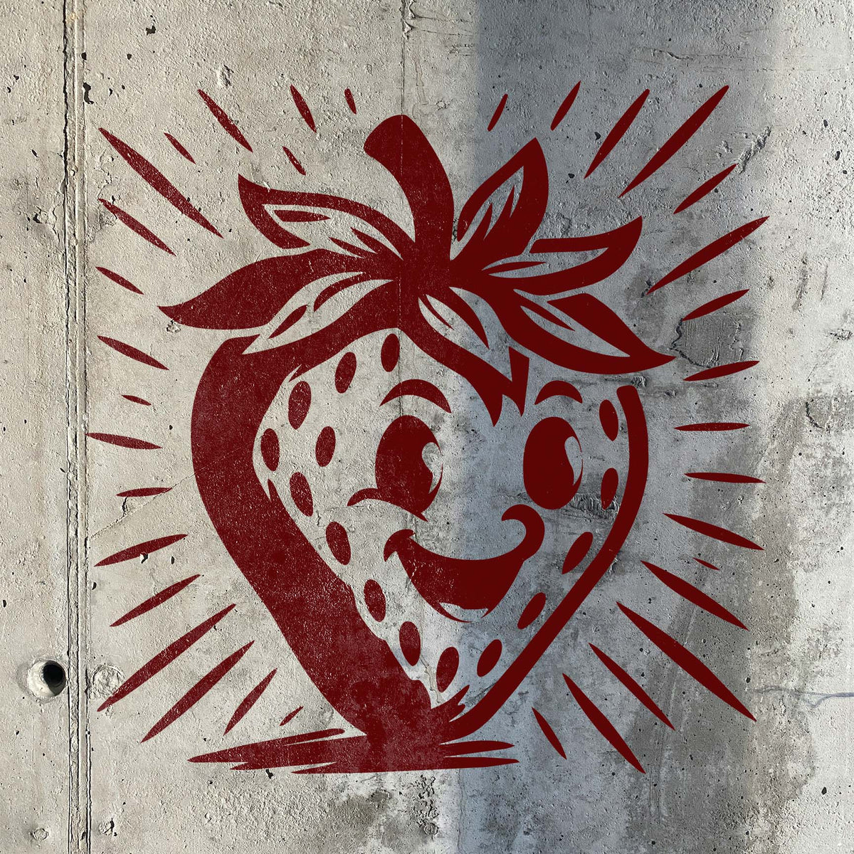 Smiling Cartoon Strawberry Stencil painted in red on a textured concrete wall.