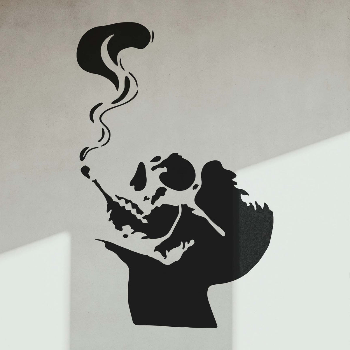 Smoking Skull Silhouette Stencil creates a striking black skull and smoke design on a modern wall