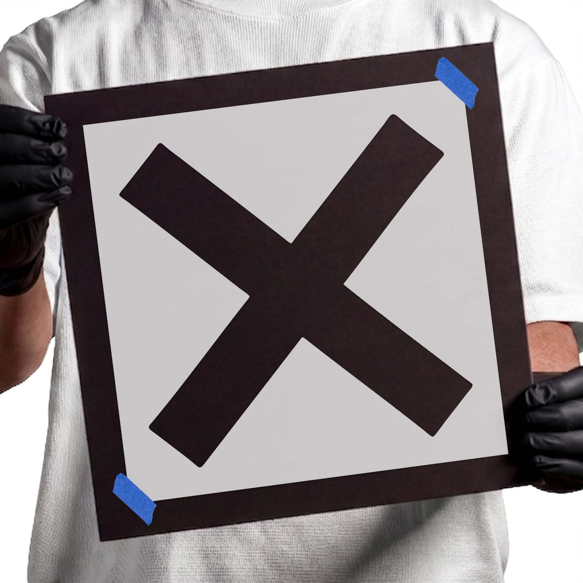 Social distancing X mark stencil featuring two thick diagonal bars crossing at the center