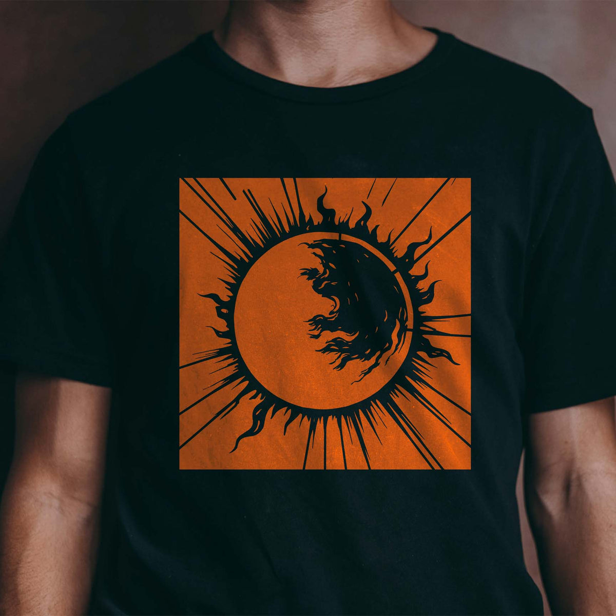 Fiery orange Solar Flare Eclipse Stencil makes a striking celestial print on a black shirt