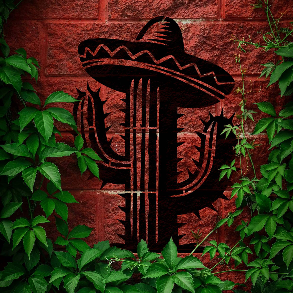 Sombrero Cactus Stencil brings a bold desert cactus design to a leafy brick wall